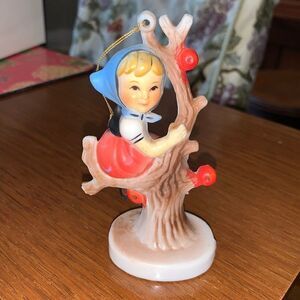 Vintage Hummel “look” girl sitting in tree Christmas tree ornament